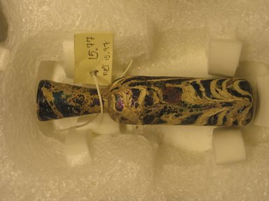 Islamic. <em>Bottle</em>, 8th-10th century. Glass, 4 x greatest diam. 7/8 in. (10.1 x 2.3 cm). Brooklyn Museum, Gift of R. B. Woodward, 15.77. Creative Commons-BY (Photo: Brooklyn Museum, CUR.15.77.jpg)