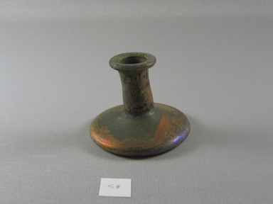 Roman. <em>Short Candlestick Bottle</em>, 1st-9th century B.C.E. Glass, 2 3/4 x Diam. 3 1/4 in. (7 x 8.2 cm). Brooklyn Museum, Bequest of Robert B. Woodward, 15.8. Creative Commons-BY (Photo: Brooklyn Museum, CUR.15.8_overall.jpg)