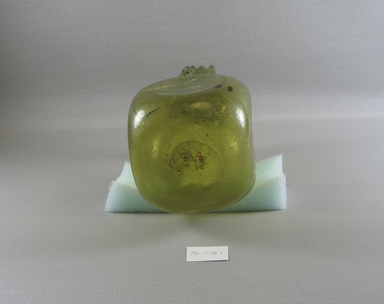  <em>Jug</em>, 4th century C.E. Glass, 7 7/8 x 4 5/16 x 4 7/16 in. (20 x 11 x 11.3 cm). Brooklyn Museum, Gift of Evangeline Wilbour Blashfield, Theodora Wilbour, and Victor Wilbour honoring the wishes of their mother, Charlotte Beebe Wilbour, as a memorial to their father, Charles Edwin Wilbour, 16.108.1. Creative Commons-BY (Photo: Brooklyn Museum, CUR.16.108.1_view3.jpg)