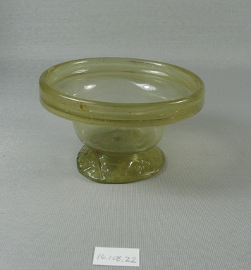 Egypto-Roman. <em>Bowl</em>, 4th century C.E. Glass, 2 5/16 x Diam. 4 1/8 in. (5.8 x 10.4 cm). Brooklyn Museum, Gift of Evangeline Wilbour Blashfield, Theodora Wilbour, and Victor Wilbour honoring the wishes of their mother, Charlotte Beebe Wilbour, as a memorial to their father, Charles Edwin Wilbour, 16.108.22. Creative Commons-BY (Photo: Brooklyn Museum, CUR.16.108.22_view1.jpg)