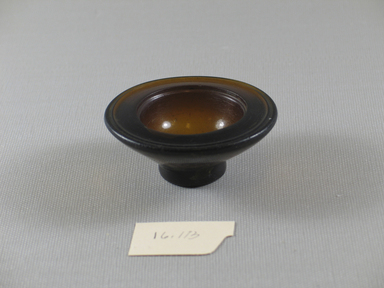 Egypto-Roman. <em>Bowl</em>, 305-30 B.C.E. Glass, 15/16 x diam. 2 9/16 in. (2.4 x 6.5 cm). Brooklyn Museum, Gift of Evangeline Wilbour Blashfield, Theodora Wilbour, and Victor Wilbour honoring the wishes of their mother, Charlotte Beebe Wilbour, as a memorial to their father, Charles Edwin Wilbour, 16.113. Creative Commons-BY (Photo: Brooklyn Museum, CUR.16.113_view1.jpg)