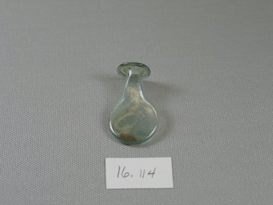 Egypto-Roman. <em>Flask</em>, 3rd-4th century C.E. Glass, 1 7/8 x  Diam. 1 in. (4.8 x 2.6 cm). Brooklyn Museum, Gift of Evangeline Wilbour Blashfield, Theodora Wilbour, and Victor Wilbour honoring the wishes of their mother, Charlotte Beebe Wilbour, as a memorial to their father, Charles Edwin Wilbour, 16.114. Creative Commons-BY (Photo: Brooklyn Museum, CUR.16.114_view1.jpg)