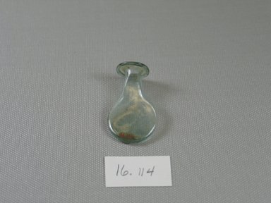 Egypto-Roman. <em>Flask</em>, 3rd–4th century C.E. Glass, 1 7/8 x  Diam. 1 in. (4.8 x 2.6 cm). Brooklyn Museum, Gift of Evangeline Wilbour Blashfield, Theodora Wilbour, and Victor Wilbour honoring the wishes of their mother, Charlotte Beebe Wilbour, as a memorial to their father, Charles Edwin Wilbour, 16.114. Creative Commons-BY (Photo: Brooklyn Museum, CUR.16.114_view1.jpg)