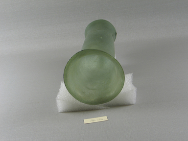 Islamic. <em>Lamp</em>, 3rd-6th century C.E. Glass, 7 1/16 x greatest diam. 3 5/16 in. (18 x 8.4 cm). Brooklyn Museum, Gift of Evangeline Wilbour Blashfield, Theodora Wilbour, and Victor Wilbour honoring the wishes of their mother, Charlotte Beebe Wilbour, as a memorial to their father, Charles Edwin Wilbour, 16.116. Creative Commons-BY (Photo: Brooklyn Museum, CUR.16.116_top.jpg)