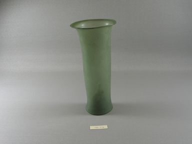 Islamic. <em>Lamp</em>, 3rd–6th century C.E. Glass, 7 1/16 x greatest diam. 3 5/16 in. (18 x 8.4 cm). Brooklyn Museum, Gift of Evangeline Wilbour Blashfield, Theodora Wilbour, and Victor Wilbour honoring the wishes of their mother, Charlotte Beebe Wilbour, as a memorial to their father, Charles Edwin Wilbour, 16.116. Creative Commons-BY (Photo: Brooklyn Museum, CUR.16.116_view1.jpg)