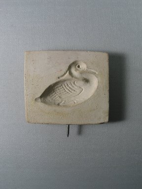  <em>Mold for Making a Benu Bird</em>. Limestone, 3 3/16 × 3 11/16 × 5/8 in. (8.1 × 9.4 × 1.6 cm). Brooklyn Museum, Gift of Evangeline Wilbour Blashfield, Theodora Wilbour, and Victor Wilbour honoring the wishes of their mother, Charlotte Beebe Wilbour, as a memorial to their father, Charles Edwin Wilbour, 16.126. Creative Commons-BY (Photo: , CUR.16.126_view01.jpg)