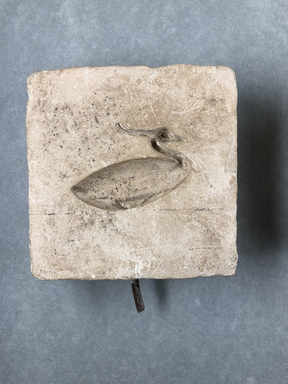  <em>Mold for Making a Benu Bird</em>. Limestone, 4 9/16 × 4 1/2 × 1 1/2 in. (11.6 × 11.5 × 3.8 cm). Brooklyn Museum, Gift of Evangeline Wilbour Blashfield, Theodora Wilbour, and Victor Wilbour honoring the wishes of their mother, Charlotte Beebe Wilbour, as a memorial to their father, Charles Edwin Wilbour, 16.127. Creative Commons-BY (Photo: , CUR.16.127_view01.jpg)
