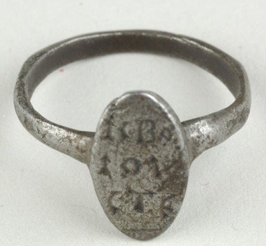 Coptic. <em>Finger Ring with Inscription</em>, 5th-7th century C.E. Iron, 9/16 × Diam. 3/4 in. (1.5 × 1.9 cm). Brooklyn Museum, Gift of Evangeline Wilbour Blashfield, Theodora Wilbour, and Victor Wilbour honoring the wishes of their mother, Charlotte Beebe Wilbour, as a memorial to their father, Charles Edwin Wilbour, 16.151. Creative Commons-BY (Photo: Brooklyn Museum (in collaboration with Index of Christian Art, Princeton University), CUR.16.151_view1_ICA.jpg)