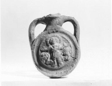 Coptic. <em>Ampulla of St. Menas</em>, 5th-7th century C.E. Terracotta, Length: 3 1/8 in. (8 cm). Brooklyn Museum, Gift of Evangeline Wilbour Blashfield, Theodora Wilbour, and Victor Wilbour honoring the wishes of their mother, Charlotte Beebe Wilbour, as a memorial to their father, Charles Edwin Wilbour, 16.164. Creative Commons-BY (Photo: Brooklyn Museum, CUR.16.164_NegE_print_bw.jpg)
