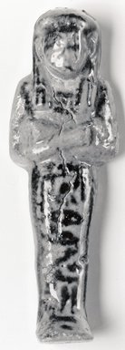  <em>Ushabti of Tay-heret</em>, ca. 1075-945 B.C.E. Faience, 3 7/8 × 1 3/8 in. (9.8 × 3.5 cm). Brooklyn Museum, Gift of Evangeline Wilbour Blashfield, Theodora Wilbour, and Victor Wilbour honoring the wishes of their mother, Charlotte Beebe Wilbour, as a memorial to their father, Charles Edwin Wilbour, 16.176. Creative Commons-BY (Photo: Brooklyn Museum, CUR.16.176_NegA_print_bw.jpg)