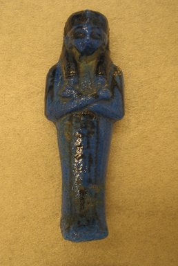  <em>Shabty of Maatkare</em>, ca. 1075-945 B.C.E. Faience, 4 5/16 × 1 5/8 in. (11 × 4.2 cm). Brooklyn Museum, Gift of Evangeline Wilbour Blashfield, Theodora Wilbour, and Victor Wilbour honoring the wishes of their mother, Charlotte Beebe Wilbour, as a memorial to their father, Charles Edwin Wilbour, 16.177. Creative Commons-BY (Photo: Brooklyn Museum, CUR.16.177_front.jpg)