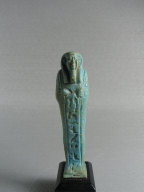  <em>Ushabti</em>, 664-332 B.C.E. Faience, 3 1/16 x 13/16 x 3/4 in. (7.8 x 2.1 x 1.9 cm). Brooklyn Museum, Gift of Evangeline Wilbour Blashfield, Theodora Wilbour, and Victor Wilbour honoring the wishes of their mother, Charlotte Beebe Wilbour, as a memorial to their father, Charles Edwin Wilbour, 16.178. Creative Commons-BY (Photo: Brooklyn Museum, CUR.16.178_view1.jpg)
