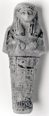  <em>Funerary Figurine of Nesi-ta-neb-ishru</em>, ca. 1075-945 B.C.E. Faience, 5 5/16 × 2 5/16 in. (13.5 × 5.9 cm). Brooklyn Museum, Gift of Evangeline Wilbour Blashfield, Theodora Wilbour, and Victor Wilbour honoring the wishes of their mother, Charlotte Beebe Wilbour, as a memorial to their father, Charles Edwin Wilbour, 16.181. Creative Commons-BY (Photo: Brooklyn Museum, CUR.16.181_NegA_print_bw.jpg)