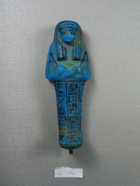  <em>Shabty of Nesi-ta-nebet-Isheru</em>, ca. 1075-945 B.C.E. Faience, 5 13/16 × 2 1/4 in. (14.7 × 5.7 cm). Brooklyn Museum, Gift of Evangeline Wilbour Blashfield, Theodora Wilbour, and Victor Wilbour honoring the wishes of their mother, Charlotte Beebe Wilbour, as a memorial to their father, Charles Edwin Wilbour, 16.186. Creative Commons-BY (Photo: Brooklyn Museum, CUR.16.186_front.jpg)