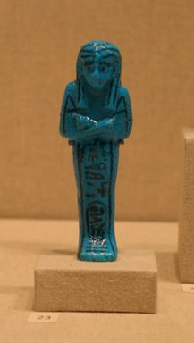  <em>Shabty of Pinudjem I</em>, ca. 1025-1007 B.C.E. Faience, 4 1/8 x W. at elbows 1 7/16 in. (10.4 x 3.7 cm). Brooklyn Museum, Gift of Evangeline Wilbour Blashfield, Theodora Wilbour, and Victor Wilbour honoring the wishes of their mother, Charlotte Beebe Wilbour, as a memorial to their father, Charles Edwin Wilbour, 16.190. Creative Commons-BY (Photo: Brooklyn Museum, CUR.16.190_wwgA-3.jpg)