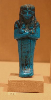  <em>Shabty of Queen Maatkare</em>, ca. 1075–945 B.C.E. Faience, 4 11/16 x  width at elbows 1 5/8 in. (11.9 x 4.2 cm). Brooklyn Museum, Gift of Evangeline Wilbour Blashfield, Theodora Wilbour, and Victor Wilbour honoring the wishes of their mother, Charlotte Beebe Wilbour, as a memorial to their father, Charles Edwin Wilbour, 16.191. Creative Commons-BY (Photo: Brooklyn Museum, CUR.16.191_wwgA-3.jpg)