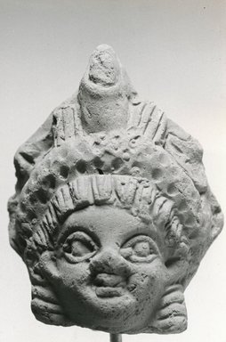  <em>Head, probably from a Statuette</em>, 3rd-4th century C.E. Terracotta, 3 3/8 x 1 11/16 x 2 9/16 in. (8.5 x 4.3 x 6.5 cm). Brooklyn Museum, Gift of Evangeline Wilbour Blashfield, Theodora Wilbour, and Victor Wilbour honoring the wishes of their mother, Charlotte Beebe Wilbour, as a memorial to their father, Charles Edwin Wilbour, 16.222. Creative Commons-BY (Photo: Brooklyn Museum, CUR.16.222_NegA_print_bw.jpg)