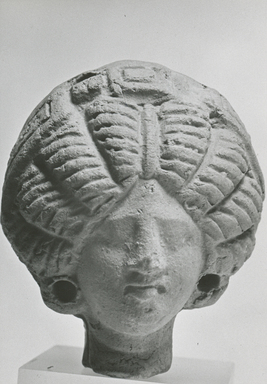  <em>Female Head</em>, 3rd century C.E. Clay, 2 5/16 x 1 15/16 x 2 1/4 in. (6 x 4.9 x 5.7 cm). Brooklyn Museum, Gift of Evangeline Wilbour Blashfield, Theodora Wilbour, and Victor Wilbour honoring the wishes of their mother, Charlotte Beebe Wilbour, as a memorial to their father, Charles Edwin Wilbour, 16.228. Creative Commons-BY (Photo: Brooklyn Museum, CUR.16.228_NegA_print_bw.jpg)