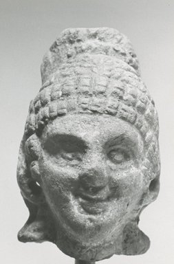  <em>Female Head</em>, 305 B.C.E.-395 C.E. Clay, pigment, 2 1/2 x 1 9/16 x 2 in. (6.4 x 3.9 x 5.1 cm). Brooklyn Museum, Gift of Evangeline Wilbour Blashfield, Theodora Wilbour, and Victor Wilbour honoring the wishes of their mother, Charlotte Beebe Wilbour, as a memorial to their father, Charles Edwin Wilbour, 16.231. Creative Commons-BY (Photo: Brooklyn Museum, CUR.16.231_NegA_print_bw.jpg)