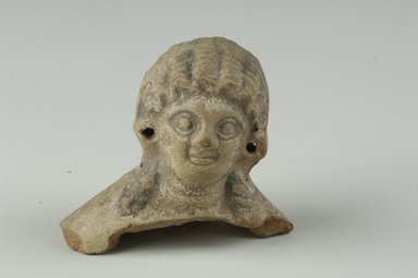 Coptic. <em>Female Head</em>, 5th–6th century C.E. Clay, pigment, 2 7/16 x 2 11/16 x 1 13/16 in. (6.2 x 6.8 x 4.6 cm). Brooklyn Museum, Gift of Evangeline Wilbour Blashfield, Theodora Wilbour, and Victor Wilbour honoring the wishes of their mother, Charlotte Beebe Wilbour, as a memorial to their father, Charles Edwin Wilbour, 16.232. Creative Commons-BY (Photo: Brooklyn Museum (in collaboration with Index of Christian Art, Princeton University), CUR.16.232_view1_ICA.jpg)