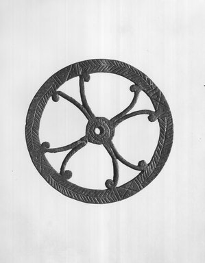 Possibly Egypto-Roman. <em>Disk or Wheel</em>, 2nd–4th century C.E. Bronze, 1/2 × Diam. 5 3/8 in. (1.3 × 13.7 cm). Brooklyn Museum, Gift of Evangeline Wilbour Blashfield, Theodora Wilbour, and Victor Wilbour honoring the wishes of their mother, Charlotte Beebe Wilbour, as a memorial to their father, Charles Edwin Wilbour, 16.235. Creative Commons-BY (Photo: Brooklyn Museum, CUR.16.235_print_negA_bw.jpg)