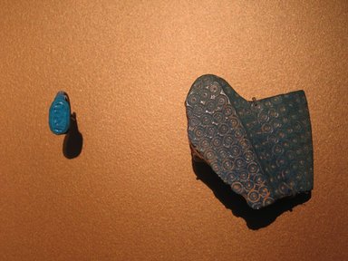  <em>Fragment of Blue Crown</em>, ca. 1352-1336 B.C.E. Faience, 2 13/16 x 2 5/8 in. (7.2 x 6.7 cm). Brooklyn Museum, Gift of the Egypt Exploration Society, 37.409. Creative Commons-BY (Photo: , CUR.16.253_37.409_erg456.jpg)