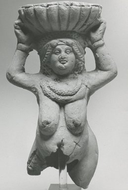  <em>Fragmentary Statuette of a Woman</em>, 3rd–4th century C.E. Clay, 5 11/16 x 3 3/8 x 2 1/2 in. (14.4 x 8.5 x 6.4 cm). Brooklyn Museum, Gift of Evangeline Wilbour Blashfield, Theodora Wilbour, and Victor Wilbour honoring the wishes of their mother, Charlotte Beebe Wilbour, as a memorial to their father, Charles Edwin Wilbour, 16.266. Creative Commons-BY (Photo: Brooklyn Museum, CUR.16.266_NegC_print_bw.jpg)