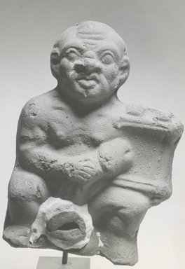  <em>Ithyphallic Man with a Harp</em>, 3rd–4th century C.E. Terracotta, pigment, 5 11/16 x 3 7/8 x 2 3/16 in. (14.4 x 9.8 x 5.6 cm). Brooklyn Museum, Gift of Evangeline Wilbour Blashfield, Theodora Wilbour, and Victor Wilbour honoring the wishes of their mother, Charlotte Beebe Wilbour, as a memorial to their father, Charles Edwin Wilbour, 16.271. Creative Commons-BY (Photo: Brooklyn Museum, CUR.16.271_NegC_print_bw.jpg)