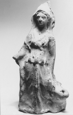  <em>Statuette of Athena or Demeter</em>, 3rd century C.E. Terracotta, pigment, 7 11/16 x 3 7/16 x 1 13/16 in. (19.6 x 8.7 x 4.6 cm). Brooklyn Museum, Gift of Evangeline Wilbour Blashfield, Theodora Wilbour, and Victor Wilbour honoring the wishes of their mother, Charlotte Beebe Wilbour, as a memorial to their father, Charles Edwin Wilbour, 16.282. Creative Commons-BY (Photo: , CUR.16.282_NegA_print_bw.jpg)