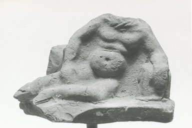  <em>Fragmentary Figurine</em>, 3rd century C.E. Terracotta, 1 11/16 x 2 3/4 in. (4.3 x 7 cm). Brooklyn Museum, Gift of Evangeline Wilbour Blashfield, Theodora Wilbour, and Victor Wilbour honoring the wishes of their mother, Charlotte Beebe Wilbour, as a memorial to their father, Charles Edwin Wilbour, 16.302. Creative Commons-BY (Photo: Brooklyn Museum, CUR.16.302_NegA_print_bw.jpg)