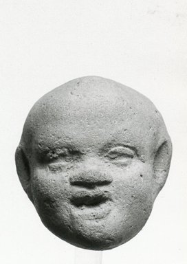 <em>Head of a Child</em>, 2nd-3rd century C.E. Terracotta, pigment, 1 9/16 x 1 3/8 x 1 7/16 in. (4 x 3.5 x 3.6 cm). Brooklyn Museum, Gift of Evangeline Wilbour Blashfield, Theodora Wilbour, and Victor Wilbour honoring the wishes of their mother, Charlotte Beebe Wilbour, as a memorial to their father, Charles Edwin Wilbour, 16.304. Creative Commons-BY (Photo: Brooklyn Museum, CUR.16.304_NegA_print_bw.jpg)