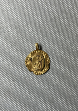  <em>Circular Disk</em>, 1st-2nd century C.E. Gold, 1/8 × 3/4 × 15/16 in. (0.3 × 1.9 × 2.4 cm). Brooklyn Museum, Gift of Evangeline Wilbour Blashfield, Theodora Wilbour, and Victor Wilbour honoring the wishes of their mother, Charlotte Beebe Wilbour, as a memorial to their father, Charles Edwin Wilbour, 16.321. Creative Commons-BY (Photo: Brooklyn Museum, CUR.16.321_overall.JPG)