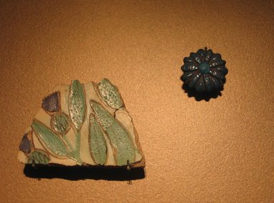  <em>Floral Inlay</em>, ca. 1352–1336 B.C.E. Faience, 2 × 2 15/16 in. (5.1 × 7.5 cm). Brooklyn Museum, Gift of the Egypt Exploration Society, 37.411. Creative Commons-BY (Photo: , CUR.16.345_37.411_erg456.jpg)