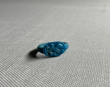  <em>Finger Ring</em>, ca. 1352-1332 B.C.E. Faience, 9/16 × 13/16 × 7/8 in. (1.5 × 2 × 2.2 cm). Brooklyn Museum, Gift of Evangeline Wilbour Blashfield, Theodora Wilbour, and Victor Wilbour honoring the wishes of their mother, Charlotte Beebe Wilbour, as a memorial to their father, Charles Edwin Wilbour, 16.354. Creative Commons-BY (Photo: Brooklyn Museum, CUR.16.354_overall01.JPG)