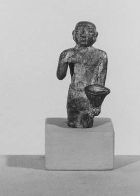  <em>Statuette</em>. Bronze, 1 13/16 x 3/4 in. (4.6 x 1.9 cm). Brooklyn Museum, Gift of Evangeline Wilbour Blashfield, Theodora Wilbour, and Victor Wilbour honoring the wishes of their mother, Charlotte Beebe Wilbour, as a memorial to their father, Charles Edwin Wilbour, 16.357. Creative Commons-BY (Photo: Brooklyn Museum, CUR.16.357_NegA_print_bw.jpg)