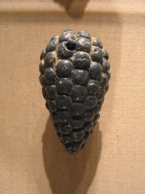  <em>Bunch of Grapes</em>, ca. 1352-1336 B.C.E. Faience, 1 7/8 x 2 7/8 in. (4.7 x 7.3 cm). Brooklyn Museum, Gift of Evangeline Wilbour Blashfield, Theodora Wilbour, and Victor Wilbour honoring the wishes of their mother, Charlotte Beebe Wilbour, as a memorial to their father, Charles Edwin Wilbour, 16.362. Creative Commons-BY (Photo: Brooklyn Museum, CUR.16.362_wwg7.jpg)