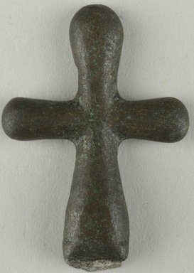 Coptic. <em>Cross</em>, 5th century C.E. Bronze, 1 3/8 × 15/16 in. (3.5 × 2.4 cm). Brooklyn Museum, Gift of Evangeline Wilbour Blashfield, Theodora Wilbour, and Victor Wilbour honoring the wishes of their mother, Charlotte Beebe Wilbour, as a memorial to their father, Charles Edwin Wilbour, 16.368. Creative Commons-BY (Photo: Brooklyn Museum (in collaboration with Index of Christian Art, Princeton University), CUR.16.368_ICA.jpg)