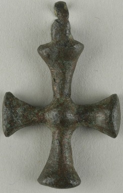 Coptic. <em>Cross Pendant</em>, 5th century C.E. Bronze, 1 1/4 × 3/4 in. (3.1 × 2 cm). Brooklyn Museum, Gift of Evangeline Wilbour Blashfield, Theodora Wilbour, and Victor Wilbour honoring the wishes of their mother, Charlotte Beebe Wilbour, as a memorial to their father, Charles Edwin Wilbour, 16.369. Creative Commons-BY (Photo: Brooklyn Museum (in collaboration with Index of Christian Art, Princeton University), CUR.16.369_ICA.jpg)