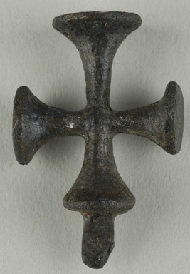 Coptic. <em>Cross Pendant</em>, 5th-7th century C.E. Bronze, 7/8 × 9/16 in. (2.2 × 1.5 cm). Brooklyn Museum, Gift of Evangeline Wilbour Blashfield, Theodora Wilbour, and Victor Wilbour honoring the wishes of their mother, Charlotte Beebe Wilbour, as a memorial to their father, Charles Edwin Wilbour, 16.371. Creative Commons-BY (Photo: Brooklyn Museum (in collaboration with Index of Christian Art, Princeton University), CUR.16.371_ICA.jpg)
