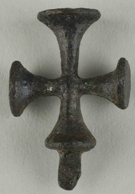 Coptic. <em>Cross Pendant</em>, 5th–7th century C.E. Bronze, 7/8 × 9/16 in. (2.2 × 1.5 cm). Brooklyn Museum, Gift of Evangeline Wilbour Blashfield, Theodora Wilbour, and Victor Wilbour honoring the wishes of their mother, Charlotte Beebe Wilbour, as a memorial to their father, Charles Edwin Wilbour, 16.371. Creative Commons-BY (Photo: Brooklyn Museum (in collaboration with Index of Christian Art, Princeton University), CUR.16.371_ICA.jpg)