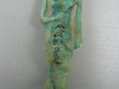  <em>Ushabti</em>, ca. 1075-712 B.C.E. Faience, 4 9/16 x 1 7/16 x 1 7/16 in. (11.6 x 3.7 x 3.7 cm). Brooklyn Museum, Gift of Evangeline Wilbour Blashfield, Theodora Wilbour, and Victor Wilbour honoring the wishes of their mother, Charlotte Beebe Wilbour, as a memorial to their father, Charles Edwin Wilbour, 16.374. Creative Commons-BY (Photo: Brooklyn Museum, CUR.16.374_view5.jpg)
