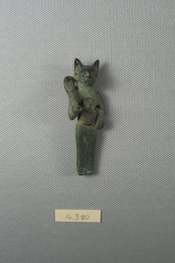  <em>Small Standing Statuette</em>. Bronze, 15/16 x 1 in. (2.5 x 2.5 cm). Brooklyn Museum, Gift of Evangeline Wilbour Blashfield, Theodora Wilbour, and Victor Wilbour honoring the wishes of their mother, Charlotte Beebe Wilbour, as a memorial to their father, Charles Edwin Wilbour, 16.380. Creative Commons-BY (Photo: Brooklyn Museum, CUR.16.380_View1.jpg)