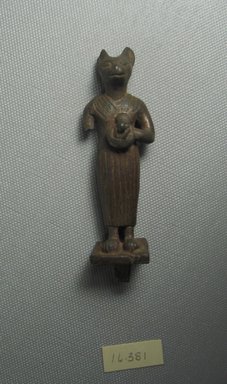  <em>Standing Bast Figure</em>. Bronze, 3 3/8 x 1 1/4 in. (8.5 x 3.1 cm). Brooklyn Museum, Gift of Evangeline Wilbour Blashfield, Theodora Wilbour, and Victor Wilbour honoring the wishes of their mother, Charlotte Beebe Wilbour, as a memorial to their father, Charles Edwin Wilbour, 16.381. Creative Commons-BY (Photo: Brooklyn Museum, CUR.16.381_View1.jpg)