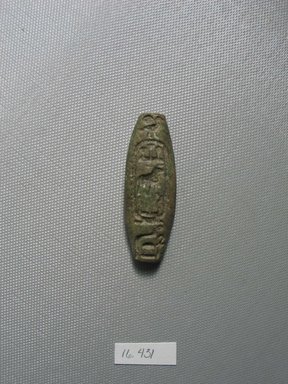 Egyptian. <em>Bead inscribed for King Shabaka</em>, ca. 716–702 B.C.E. Faience, 13/16 x 3/8 x 2 5/16 in. (2 x 1 x 5.8 cm). Brooklyn Museum, Gift of Evangeline Wilbour Blashfield, Theodora Wilbour, and Victor Wilbour honoring the wishes of their mother, Charlotte Beebe Wilbour, as a memorial to their father, Charles Edwin Wilbour, 16.431. Creative Commons-BY (Photo: Brooklyn Museum, CUR.16.431_view1.jpg)