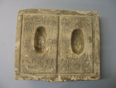 Graeco-Egyptian. <em>Offering Table with a Dedication of Ammonios, Parine, Potamon, and Emesous to the Nile</em>, 30 B.C.E.–395 C.E. Limestone, 3 3/4 × 10 3/4 × 12 3/8 in. (9.5 × 27.3 × 31.5 cm). Brooklyn Museum, Gift of Evangeline Wilbour Blashfield, Theodora Wilbour, and Victor Wilbour honoring the wishes of their mother, Charlotte Beebe Wilbour, as a memorial to their father, Charles Edwin Wilbour, 16.440. Creative Commons-BY (Photo: , CUR.16.440_view01.jpg)