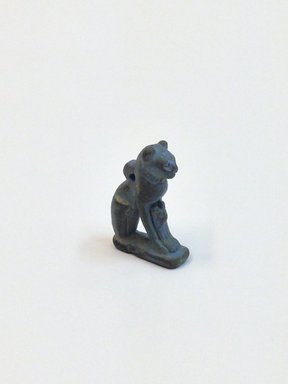  <em>Amulet of Bastet, in the Form of a Cat with Kitten</em>. Glass, 11/16 × 1 5/8 in. (1.7 × 4.2 cm). Brooklyn Museum, Gift of Evangeline Wilbour Blashfield, Theodora Wilbour, and Victor Wilbour honoring the wishes of their mother, Charlotte Beebe Wilbour, as a memorial to their father, Charles Edwin Wilbour, 16.580.102. Creative Commons-BY (Photo: Brooklyn Museum, CUR.16.580.102_view3.jpg)