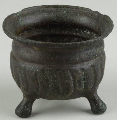 Coptic. <em>Vessel with 3 Feet</em>, 5th-7th century C.E. Bronze, 2 1/16 x Diam. 2 11/16 in. (5.3 x 6.8 cm). Brooklyn Museum, Gift of Evangeline Wilbour Blashfield, Theodora Wilbour, and Victor Wilbour honoring the wishes of their mother, Charlotte Beebe Wilbour, as a memorial to their father, Charles Edwin Wilbour, 16.580.161. Creative Commons-BY (Photo: Brooklyn Museum (in collaboration with Index of Christian Art, Princeton University), CUR.16.580.161_view1_ICA.jpg)