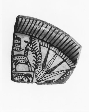  <em>Fragment of Bowl with Lotus, Antelope, and Fish</em>, ca. 1539-1390 B.C.E. Faience, 3 1/8 x 3 1/16 in. (8 x 7.7 cm). Brooklyn Museum, Gift of Evangeline Wilbour Blashfield, Theodora Wilbour, and Victor Wilbour honoring the wishes of their mother, Charlotte Beebe Wilbour, as a memorial to their father Charles Edwin Wilbour, 16.580.176. Creative Commons-BY (Photo: Brooklyn Museum, CUR.16.580.176_NegA_print_bw.jpg)