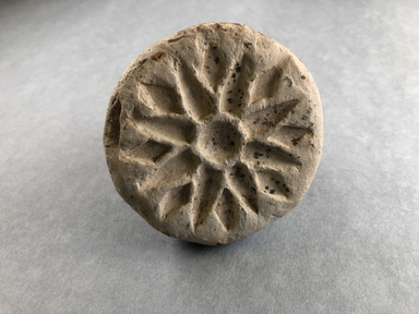  <em>Stamp?</em>. Limestone, pigment (?), 2 3/8 × Diam. 3 1/16 in. (6 × 7.7 cm). Brooklyn Museum, Gift of Evangeline Wilbour Blashfield, Theodora Wilbour, and Victor Wilbour honoring the wishes of their mother, Charlotte Beebe Wilbour, as a memorial to their father, Charles Edwin Wilbour, 16.580.211. Creative Commons-BY (Photo: , CUR.16.580.211_view01.jpg)
