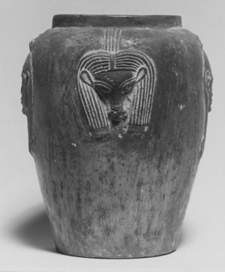  <em>Vase with Hathor Heads</em>. Clay, 4 7/16 × Diam. 3 7/16 in. (11.3 × 8.8 cm). Brooklyn Museum, Gift of Evangeline Wilbour Blashfield, Theodora Wilbour, and Victor Wilbour honoring the wishes of their mother, Charlotte Beebe Wilbour, as a memorial to their father, Charles Edwin Wilbour, 16.580.217. Creative Commons-BY (Photo: , CUR.16.580.217_NegID_L_166_15_print_bw.jpg)